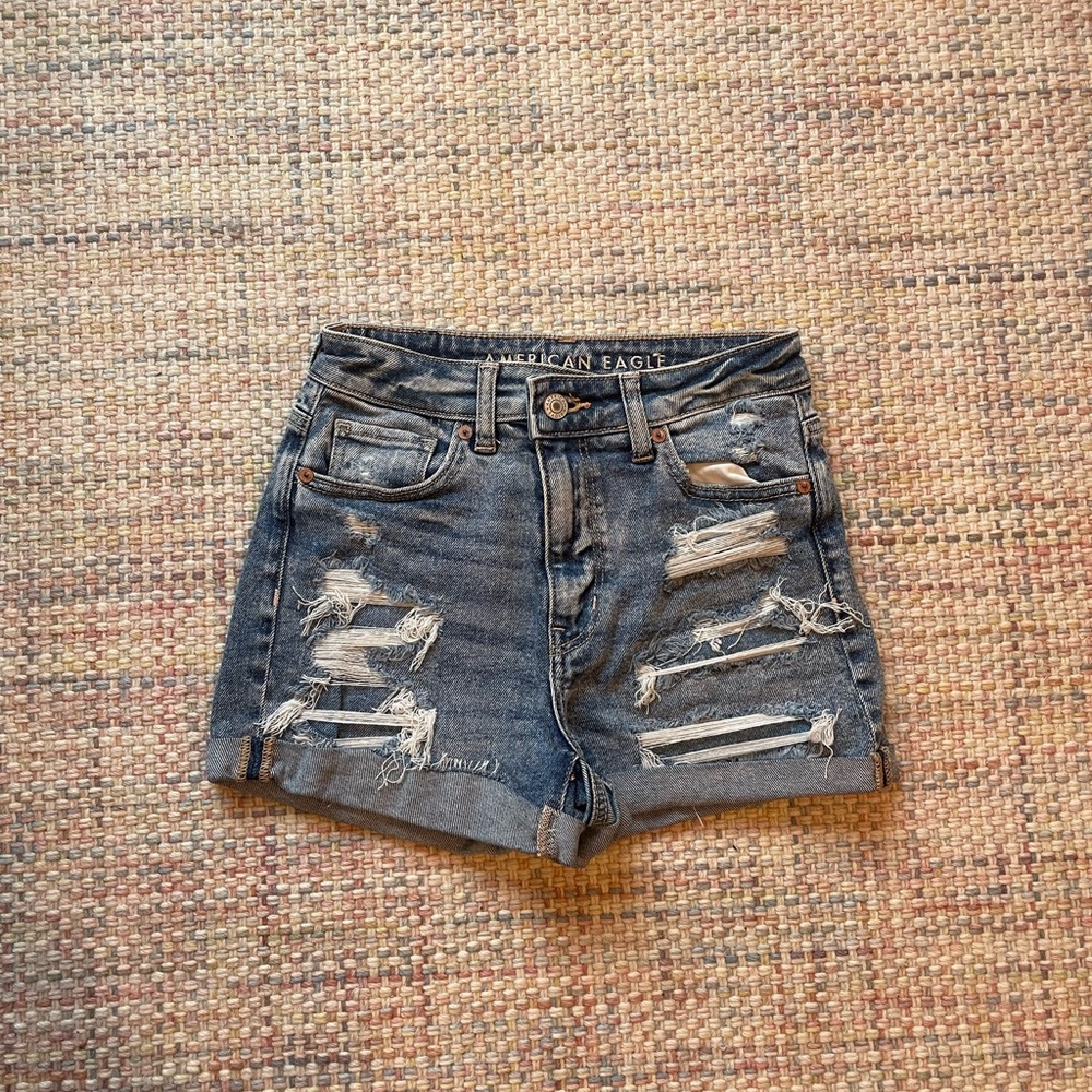 american eagle ripped blue denim shorts in size 24